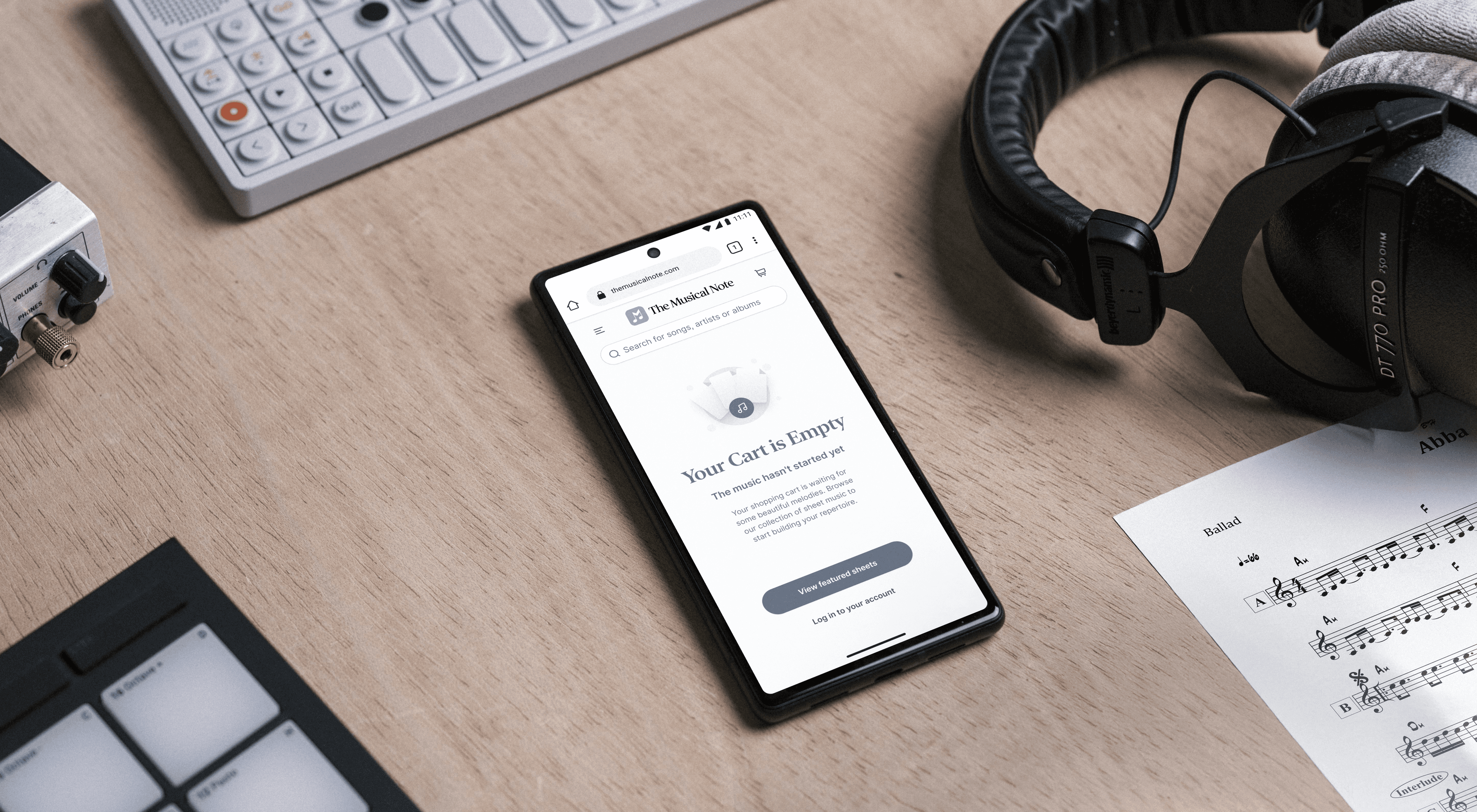 google pixel 6 in studio setting showing themusicalnote.com on the screen